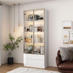 a living room with a couch, chair and book case in it's corner