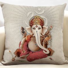 an elephant sitting on top of a pillow with the image of gandapa in it