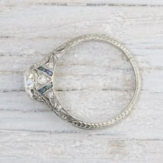 an antique style diamond and sapphire ring