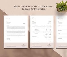 two business card templates sitting on top of each other next to a plant and potted plant