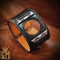 "This black leather apple watch cuff watchband uses the highest quality natural vegetable-tanned leather and is hand stitched throughout. A soft calfskin lining hugs your wrist and a high quality roller buckle closes it up! I'll need your wrist size, Apple watch size (40, 42mm or 38mm) Apple watch adapter finish (grey, stainless. polished) I Can size it for men or women Adapters included! Can be made many finishes and colors. Just ask! - 1-3/4\" wide - Hand saddle stitched - Vegetable tanned lea Apple Watch Cuff, Leather Watch Cuff, Apple Watch Bands Fashion, Apple Watch Leather Strap, Apple Watch Sizes, Leather Wristbands, Cuff Watch, Apple Watch Bands Leather, Watch Bracelet