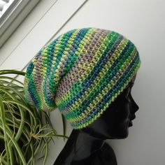 Crochet hat with noble matt lustre effects through merino wool and dazzling silk. 70% Merino wool, 20% Viscose, 10% Silk. Lana Grossa yarn (Italy) Light green, yellow green, gray, petrol beanie. Ready to ship. This hat best fits an average adult/teen head size. If you need this hat in a different size or in any other color please just let me know! All my hats are produced in a smoke-free and pets-free home. Care instruction:  Hand wash and lay flat to dry. Thank you for visiting JuliaHats! Have Bonnet En Crochet, Knit Slouchy Hats, Womens Slouchy Beanie, Knitted Wool Beanie, African Hats, Women Beanie, Handmade Hats, Blue Beanie, Bonnet Crochet