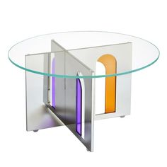 a glass table with an orange and purple door on it's center piece, in front of a white background