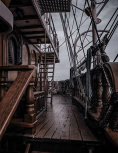 the deck of a ship with ropes and ladders