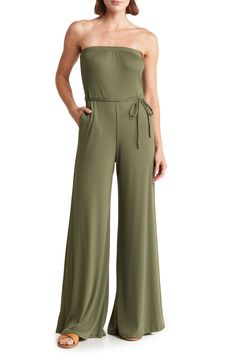 Ribbed fabric adds a subtle texture to a wide-leg jumpsuit topped with a strapless profile for a summery look. Strapless Side-seam pockets Removable waist tie 90% modal, 10% spandex Hand wash, dry flat Made in the USA of imported fabric Model stats: 5'10" height, 32" bust, 25" waist, 36" hip. Model is wearing size Small. Solid Color Strapless Stretch Jumpsuit With Wide Leg, Stretch Strapless Jumpsuit With Wide Legs, Casual Strapless Wide Leg Jumpsuit With Stretch, Casual Strapless Wide-leg Jumpsuit With Stretch, Casual Stretch Strapless Wide Leg Jumpsuit, Casual Strapless Wide Leg Jumpsuit, Versatile Wide Leg Jumpsuit Or Romper, Stretch Strapless Wide Leg Jumpsuit, Summer Solid Color Stretch Strapless Jumpsuit