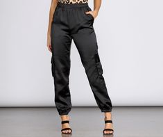 Sleek satin is your new go-to. These joggers feature a high rise elastic banded waist. slanted front pockets. cargo style side pockets. and a tapered jogger hem. The relaxed fitting pants are composed of a satin-like fabric with no stretch. Jogger Outfit, Satin Joggers, Fitting Pants, Cami Midi Dress, Maxi Dress Pattern, Ribbed Mini Dress, Cargo Style, Children Shoes, Maxi Knit Dress