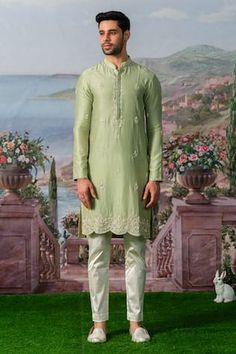 Green kurta with scalloped hem and scattered butti embroidery using zardozi, pearls. Paired with a pant. - Aza Fashions Eid Green Sherwani With Floral Embroidery, Transitional Pista Green Kurta With Embroidered Border, Green Sherwani With Floral Embroidery, Fitted Pista Green Kurta With Gota Work, Pista Green Embroidered Dupatta For Navratri, Fitted Pista Green Kurta With Embroidered Border, Pista Green Embroidered Kurta, Festive Pista Green Kurta With Embroidered Border, Diwali Embroidered Border Pista Green Kurta