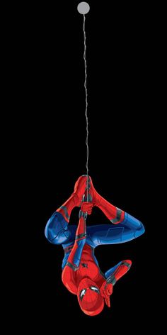 a spider man hanging upside down from the ceiling