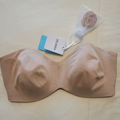 Delimira Unlined Strapless Bra. New With Tags. Includes Optional Straps That Can Be Worn Multiple Ways. Soft, Lightweight Material. Oatmeal. Size 34 E. Beige Seamless Strapless Bra, Beige Bandeau Bra, Beige Stretch Underwire Bra, Fitted Beige Bra For Beach, Beige Fitted Bra For Beach, Satin Bra, Lounge Bra, Pink Bralette, High Impact Sports Bra