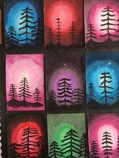 several small paintings with trees painted on them