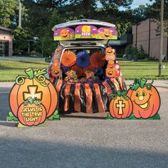 a car decorated with pumpkins and decorations