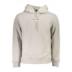 Elevate Your Casual Wardrobe With This Cozy, Eco-Conscious Calvin Klein Hooded Sweatshirt. Crafted With A Blend Of Soft Cotton And Durable Polyester, Featuring 20% Recycled Cotton, This Gray Sweatshirt Boasts A Comfortable Fleece Feel Perfect For Your Everyday Ensemble. The Sleek Embroidery And Bold Logo Add A Touch Of Luxury To An Everyday Staple, Ensuring You Stay Stylish While Making An Environmentally Friendly Choice. Material: 62% Cotton, 38% Polyester Country Of Origin: Tr Color: Gray We A Calvin Klein Crew Neck Sweatshirt With Ribbed Cuffs, Calvin Klein Winter Sweatshirt With Ribbed Cuffs, Calvin Klein Crew Neck Winter Sweatshirt, Calvin Klein Crew Neck Sweatshirt For Winter, Calvin Klein Sporty Sweatshirt With Ribbed Cuffs, Heather Grey Fleece Sweatshirt With Adjustable Hood, Calvin Klein Sweatshirt With Ribbed Cuffs For Streetwear, Calvin Klein Hooded Sweatshirt For Fall, Calvin Klein Hooded Hoodie For Fall