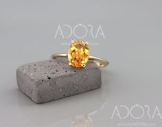 ✿ THE JEWEL 14k Solid Gold Citrine Engagement Ring. A remarkable, and bold oval cut solitaire ring set with a natural Gem. A dainty Citrine ring, no one can ignore. If you are looking for something exceptional, this ring is for you! ✿ THE LITTLE DETAILS... Your ring will be handmade form 14k (or 18k) gold. Ring's width is 1.5mm. For the center stone I will set a 9x7mm/~1.80ct Oval Cut natural Citrine gem. You can select the center stone gem from the drop-down menu. ** Please note since I use nat Yellow Oval Topaz Ring In 14k Gold, Orange Oval Jewelry With Prong Setting, Oval Citrine Solitaire Jewelry, Oval Solitaire Citrine Jewelry, Modern Orange Oval Rings, Oval Yellow Topaz Ring In 14k Gold, Orange Oval Birthstone Ring, Oval Orange Birthstone Ring, Classic Oval Orange Topaz Ring