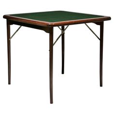 a small wooden table with a green cloth on it's top and two legs