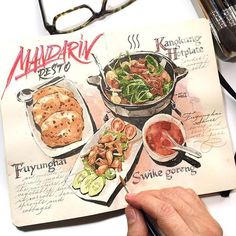 a hand holding a pen and drawing on top of a recipe book with food in it