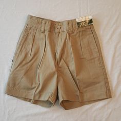 These Vintage Pleated Khaki Shorts From Polo By Ralph Lauren Are New With Tags. Vintage Saks Price Tag Not Attached But Included. Zip And Button Fly, 2 Side Pockets, 2 Back Buttoned Pockets, Logo On Side. Boys Size 8 Regular. Made In Usa. Waist 23", Length 3 (Approximately 12.5"). These Classic Shorts Never Go Out Of Style! High-waist School Uniform Bottoms For Summer, High Waist School Uniform Bottoms For Summer, High Waist Bottoms For School In Summer, High Waist Shorts For School In Spring, High-waisted Bottoms For School In Summer, High Waist Shorts For Spring School Season, High Waist Shorts For School During Spring, High-waisted Bottoms For School Summer Season, Classic Summer School Bottoms