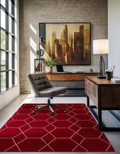 a red rug in the middle of a room with a chair, desk and window