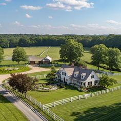 an aerial view of a large farm house