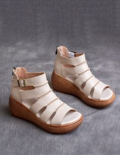 Beige Toe Post Wedge Sandals, Summer Leather Wedge Sandals With Ankle Strap, Summer T-strap Sandals With Removable Insole And Wedge Heel, Summer T-strap Wedge Sandals With Removable Insole, Leather Wedge Sandals With Ankle Strap For Summer, Spring Toe Post Wedge Sandals With Buckle, Leather Ankle Strap Wedge Sandals For Summer, Spring Toe Post Wedge Sandals With Buckle Closure, White T-strap Sandals With Heel Loop For Summer