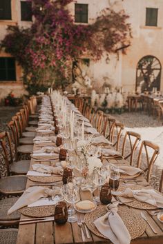 a long table is set with place settings