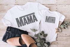 The cutest matching Mama and Mini shirts for you and your little one! *Please note this is not a set, please add each shirt to your cart separately!Bella + Canvas Unisex Jersey Tee and Toddler Tee-4.2 oz 100% airline combed and ringspun cotton-Retail Fit-Unisex sizing-Coverstitched collar and sleeves-Shoulder to shoulder taping-Side seams-Tear away labelBaby Bodysuit Details:-Preshrunk-100% Ringspun & Combed Cotton- Finished Sleeves. Piped Neckline & Legs. Enveloped Neck.-3 Metal Color Matched S Mama And Mini Shirts, Mini Shirts, Bleach Fabric, Mama And Mini, Grey Bodysuit, Toddler Tees, Jersey Tee, Matching Shirts, Black Bodysuit