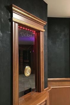 there is a mirror that says tickets on it