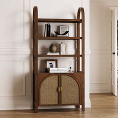 a book shelf with books and other items on it in the corner of a room