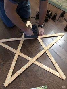 a person is making a star out of wood