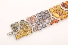 Multi Color Sapphire and Diamond Bracelet.  For Sale on 1stdibs - 82 green, orange, yellow, pink and blue sapphires approximately 60 carats 237 diamonds approximately 3.00 carats 18k yellow gold. 3 of 3. Multicolor Multi-stone Luxury Diamond Bracelet, Luxury Multicolor Diamond Bracelet For Formal Occasions, Multicolor Luxury Diamond Bracelet For Formal Occasions, Multicolor Diamond Bracelet For Formal Occasions, Multicolor Diamond Bracelet With 17 Jewels, Luxury Multicolor Diamond Bracelets, Multicolor Multi-stone Diamond Bracelet For Formal Occasions, Fine Jewelry Multicolor Gemstone Diamond Bracelet, Multicolor Gemstone Diamond Bracelet