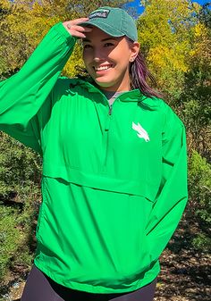 Champion North Texas Mean Green Mens Green Primary Logo Light Weight Jacket Sporty Hooded Outerwear For Game Day, Sporty Green Windbreaker For Fall, Casual Winter Track Jacket For Game Day, Green Moisture-wicking Track Jacket For Outdoor, Winter Green Moisture-wicking Windbreaker, Casual Fall Windbreaker For Sports Events, Team-colored Fall Outerwear For Fan Gear, Casual Fan Gear Track Jacket For Sports Season, Casual Track Jacket For Sports Fans