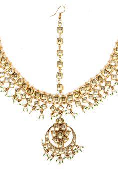 Classic and Elegant Kundan Mangtikka with high grade shell pearls.look stylish and flaunt your signature style by wearing mangtikka. It will elevate your style quotient in no time. Made from superior quality 24k gold plated copper and silver alloy. Top size - 6 cm Hair chain - Freesize. STYLE TIP - This one is for effortless styling with your traditional wear. Team this with anything traditional for easy peasy classic dressing. This Mang tikka is a perfect accessory to dress any look up - Simple Festive Kundan Necklace With Cutdana For Reception, Festive Kundan Necklace With Stone Work For Ceremonial Occasions, Ceremonial Kundan Necklace With Stone Work For Festive Occasions, Ceremonial Festive Kundan Necklace With Stone Work, Festive Cutdana Kundan Necklace For Reception, Ceremonial Kundan Necklace With Stone Work For Eid, Festive Meenakari Tikka For Reception, Meenakari Tikka For Diwali Reception, Kundan Temple Jewelry Tikka For Reception