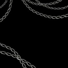 a black background with silver chains on it