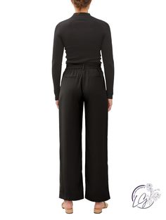 Step into a world of refined sophistication with the All-Day Elegance Trousers – a perfect blend of timeless style and modern comfort. These wide-leg, high-waist dress pants effortlessly elevate your wardrobe, offering versatility for any occasion. Crafted with meticulous attention to detail, these trousers feature a tailored fit that complements the figure, while the high-waist design adds a touch of classic elegance. The elastic back ensures a comfortable and customizable fit, allowing you to Elegant Stretch Wide Leg Pants For Formal Occasions, Elegant Wide Leg Full Length Pants With Elastic Waistband, Elegant Wide Leg Pants With Elastic Waistband, Sleek Formal Pants With Elastic Waistband, Elegant Stretch Wide Leg Pants With Elastic Waistband, Elegant Leather Pants For Fall, Chic Formal Dress Pants With Elastic Waistband, Elegant Ankle-length Wide Leg Pants With Elastic Waistband, Elegant Formal Dress Pants With Elastic Waistband