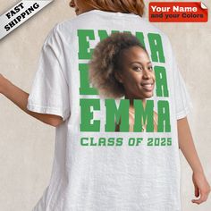 a woman wearing a t - shirt with an emra emra class of 205 on it