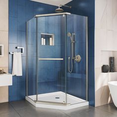 a bathroom with blue walls and tile flooring, including a walk - in shower