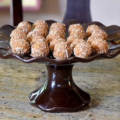 there are many donuts that are on the cake platter and ready to be eaten