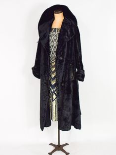 "~ 1900s Beautiful black cotton velvet evening coat ~ Straight from Downton Abbey ~ 2 button front with sash, 1 shows wear ~ Long cuffed sleeves ~ Portrait collar ~ 2 front pockets ~ Silk lining ( one 2-3\" patch inside ) ~ Large tassels attached to sides ~ Very good for its age! Bust- 50\" (127 cm) Waist- 48\" (121.92 cm) Hips- 56\" (142.24 cm) Length- 48\" (121.92 cm) Cuffed Sleeve- 24\" (60.96 cm) Shoulder- 16.5\" (41.91 cm) More Incredible Vintage: glennasvintageshop.etsy.com Vintage Jewelry Large Tassels, Black Velvet Coat, Layered Ruffle Dress, Evening Coat, Velvet Coat, Cuffed Sleeve, 60s Dress, Coat Black, Downton Abbey