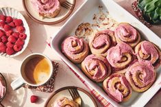 there are many desserts on the table with raspberries