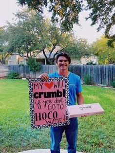 a man holding up a sign that says, my will crumb if you don't go to cocoa