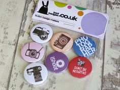 some badges are sitting on a table