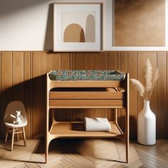 a baby crib in the corner of a room with wood paneling and pictures on the wall