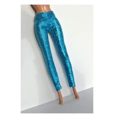 a mannequin's leg wearing blue sequin pants