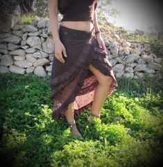 ♡ Designed in a unique free flowing 3 layered fashion that wraps around, this skirt is perfect for every occasion. It is made with 100% cotton and a beautiful lace pattern to keep you comfortable in every situation whether it is a festival or doing daily activities. Wear this skirt to feel magical and beautiful! Please pick your preferred color option from the drop-down menu above. ✦ Sizing Wrap around style - One size fits most From S - XL ✦ Colors - Brown - Massala - Beige - Green - Bordeaux - Bohemian Asymmetrical Mini Skirt, Ruffled Mini Skirt For Festival, Festival Ruffled Mini Skirt, Fitted Bohemian Brown Mini Skirt, Fitted Brown Tiered Skirt, Festival Mini Ruffled Skirt, Beach Skirt With Ruffled Asymmetrical Hem, Bohemian Asymmetrical Maxi Skirt With Fitted Style, Fitted Bohemian Skirt With Ruffles