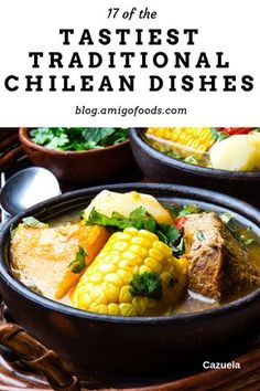 two bowls filled with stew and corn on the cob, next to other dishes