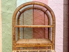 a wicker shelf with two shelves on it