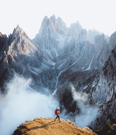 a person standing on top of a mountain