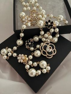 Stay on top of the latest fashion trends with our Luxury Long Multi-layer Flower Pearl Necklace. Featuring a stunning double-layer design with delicate pearls and a luxurious camellia charm, this necklace is a must-have for any style-savvy woman. With its elegant and versatile design, it also makes for a perfect gift for the special women in your life. Upgrade your jewelry collection with this trendy and timeless piece. This luxurious pearl layer necklace adorned with beautiful flowers made of p Luxury Beaded Necklaces With Pearl Embellishments, Luxury Elegant Necklaces With Pearl Embellishments, Luxury Pearl Embellished Necklace, Luxury Rhinestone Necklace As Gift, Luxury Festive Necklace With Pearl Embellishments, Luxury Pearl Necklace For Party, Luxury Handmade Beaded Necklaces For Celebration, Luxury Party Necklace With Dangling Beads, Luxury Beaded Necklaces With 17 Jewels As A Gift