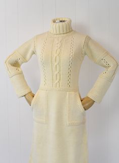 "Info: ♥ Circa: 70s ♥ Label: Courreges (tag is missing but the embroidery on the bodice is unmistakable) ♥ Color: Cream ♥ Material: Wool ♥ Condition: Excellent vintage condition. Details: ♥ Cozy Courreges sweater dress ♥ Soft cream colored wool ♥ High turtleneck ♥ Two pockets, one on each side ♥ Pullover style, no closures ♥ Unlined Measurements: Bust: 32\"-snug 40\" Waist: 28\"-32\" Hips: 38\"-42\" Length: 42.5\" Sleeve Length: 19\" ♥ ♥ All garments are measured flat, then doubled for the bust, Vintage Beige Winter Dress, Vintage Beige Dress For Winter, Vintage Beige Dresses For Winter, Fitted White Vintage Dress For Fall, Fitted Cream Dress For Winter, 1970s Fitted Beige Dress, Cream Fitted Long Sleeve Vintage Dress, Fitted Long Sleeve Cream Vintage Dress, Fitted Knee-length Vintage Dress For Winter