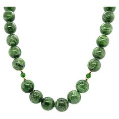 10mm Variegated Chrome Diopside Beaded Necklace with Yellow Gold Accents | From a unique collection of vintage Beaded Necklaces at https://www.1stdibs.com/jewelry/necklaces/beaded-necklaces/. Luxury Green Beaded Necklaces For Celebration, Cheap Green Beaded Pendant Necklace, Luxury Antique Beaded Necklace With Polished Beads, Luxury Antique Gemstone Beaded Necklaces, Luxury Green Agate Beaded Necklaces, Luxury Green Multi-stone Beaded Necklace, Cheap Vintage Beaded Necklaces With Polished Beads, South African Necklace Green, Strand Of Pearls