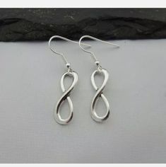 Brand New Infinity Symbol Silver Tone Earrings. Makes An Excellent Gift. Silver Hypoallergenic Infinity Earrings, Hypoallergenic Infinity Earrings For Gift, Silver Design, Handmade Wire Jewelry, Infinity Symbol, Handmade Wire, Earrings Color, Wire Jewelry, Silver Tone